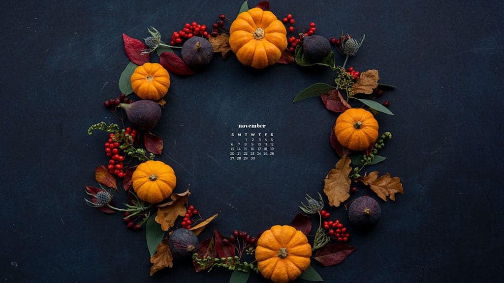 navy background with colorful pumpkins, berries, and fall foliage in a circle wreath flat lay - thanksgiving inspired shot November 2022 wallpapers – FREE calendars in Sunday & Monday starts + no-calendar designs. 59 beautiful options for desktop & smart phones!