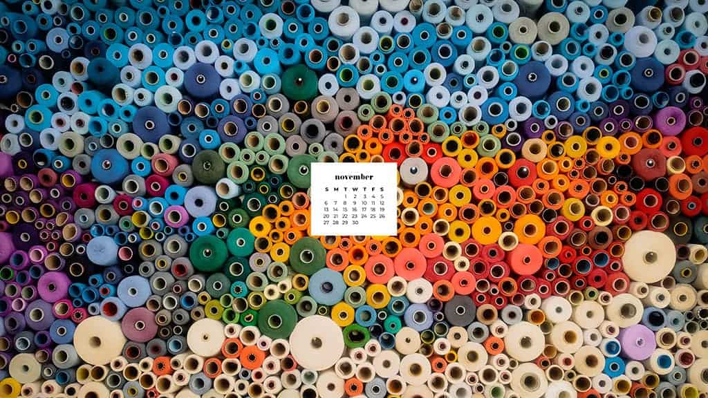 colorful rolls of fabric stacked on a shelf November 2022 wallpapers – FREE calendars in Sunday & Monday starts + no-calendar designs. 59 beautiful options for desktop & smart phones!