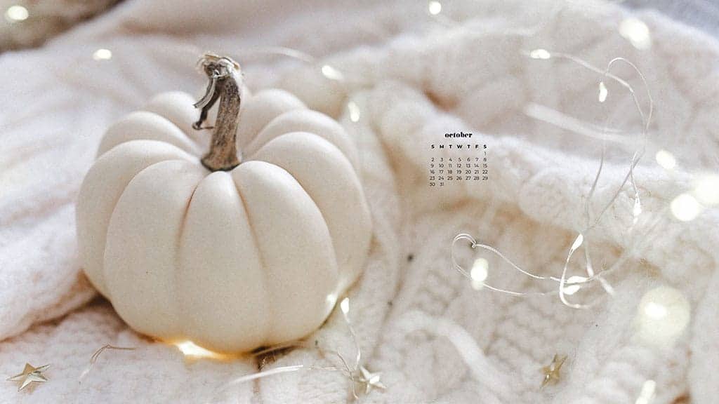 white pumpkin and fairy lights on a cozy soft white blanket October 2022 wallpapers – FREE calendars in Sunday & Monday starts + no-calendar designs. 55 beautiful options for desktop & smart phones!