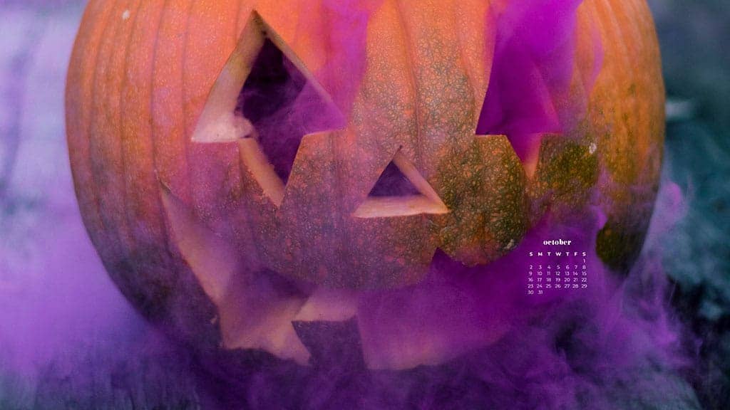 orange pumpkin with purple smoke coming out of eyes, nose and mouth October 2022 wallpapers – FREE calendars in Sunday & Monday starts + no-calendar designs. 55 beautiful options for desktop & smart phones!