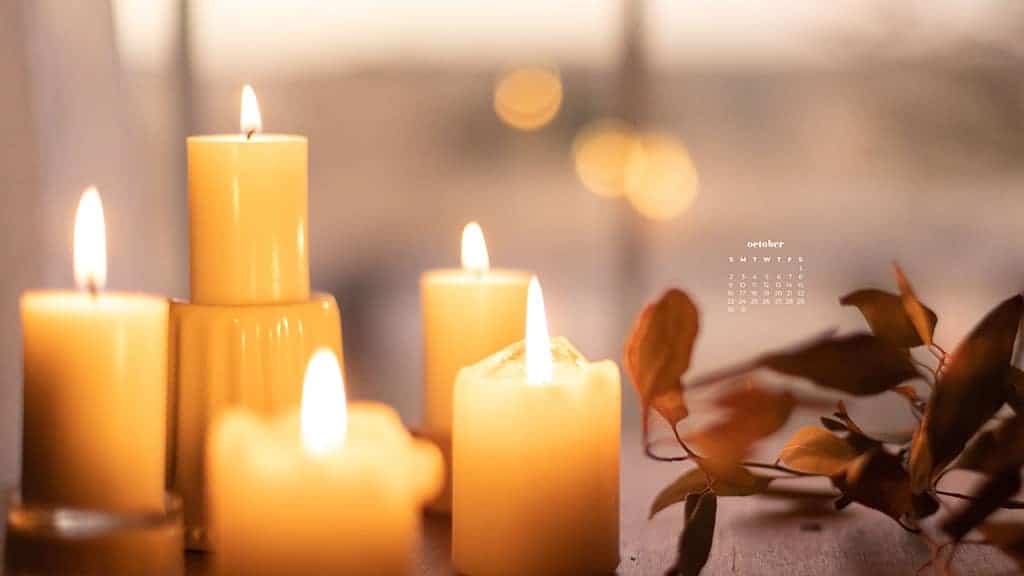 cream colored candle pillars with bokeh lights in and leaves in background October 2022 wallpapers – FREE calendars in Sunday & Monday starts + no-calendar designs. 55 beautiful options for desktop & smart phones!
