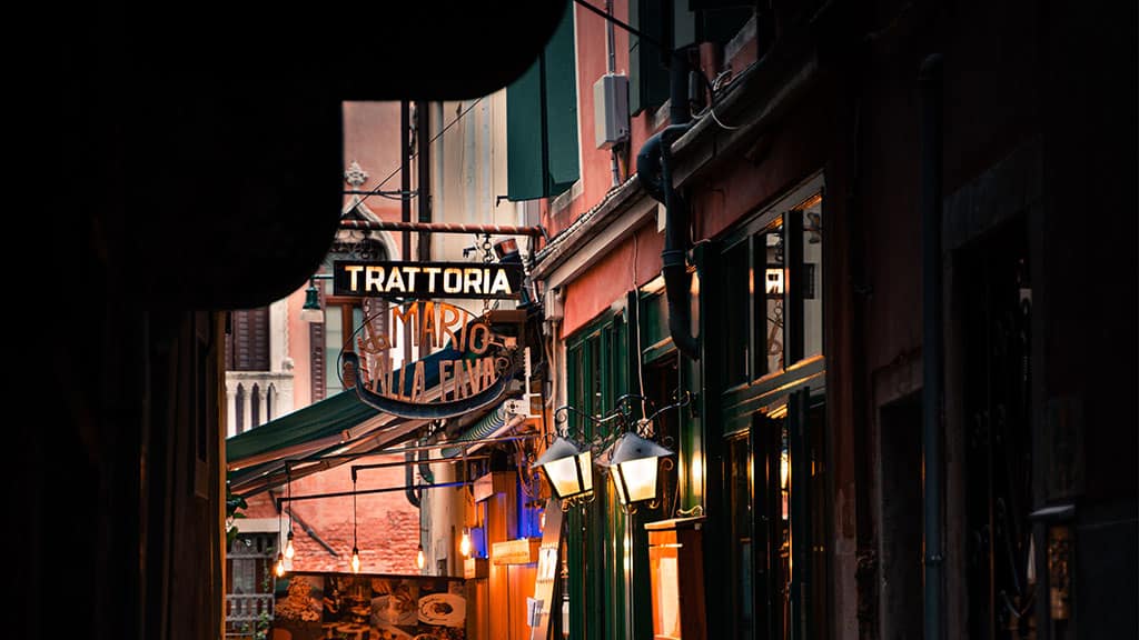 an italian street cafe in the evening