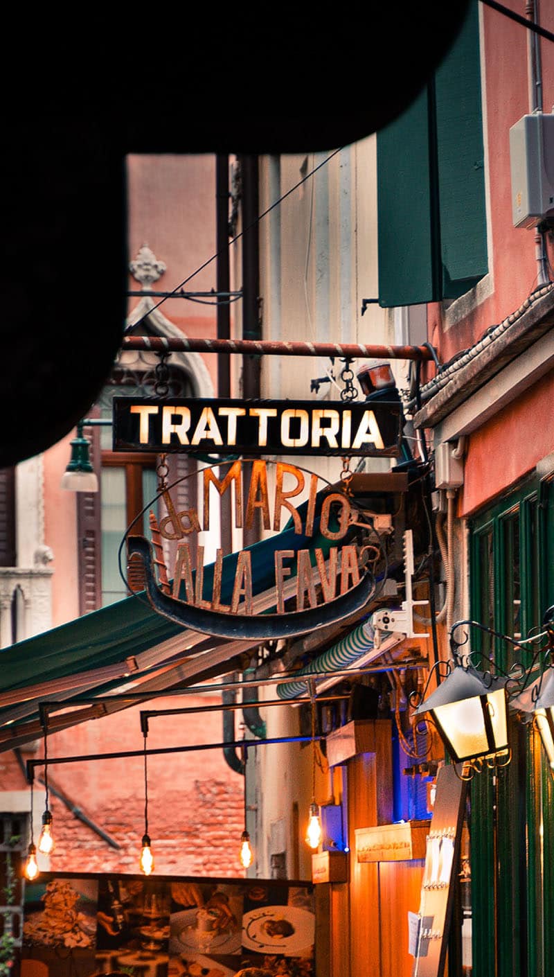 an italian street cafe in the evening