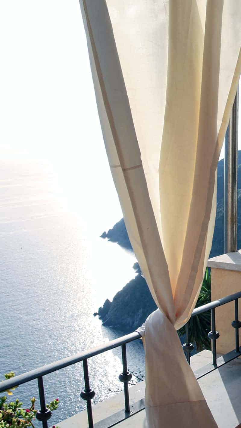 cafe outside on the sea with white curtains 