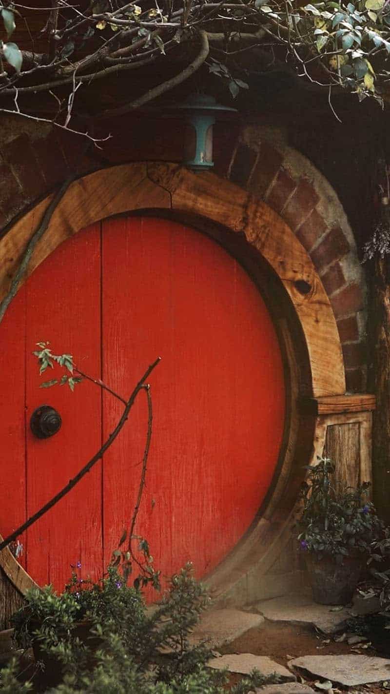 colorful hobbit house with red front door