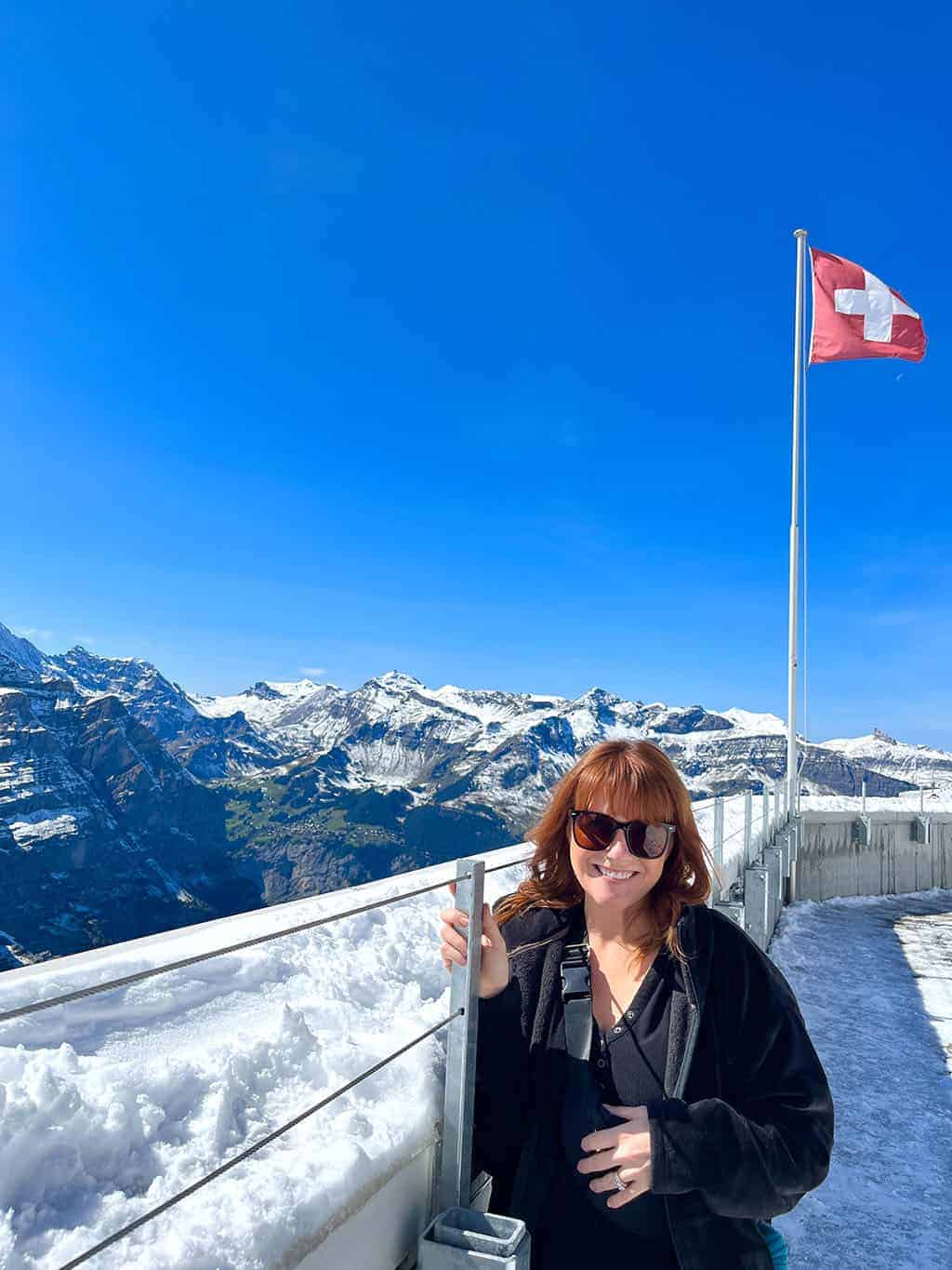 Jungfraujoch – Top of Europe Adventure – view off of the cable car by the Swiss flag