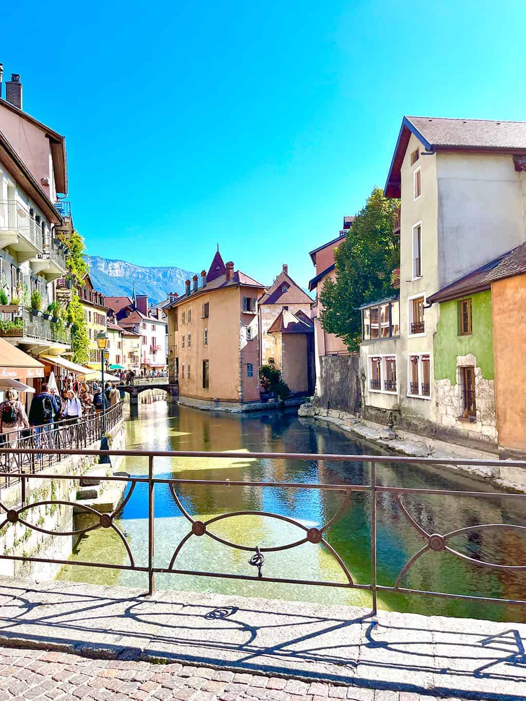 Day trip to Annecy France - Cobblestone streets, colorful architecture, and a stunning crystal blue lake.