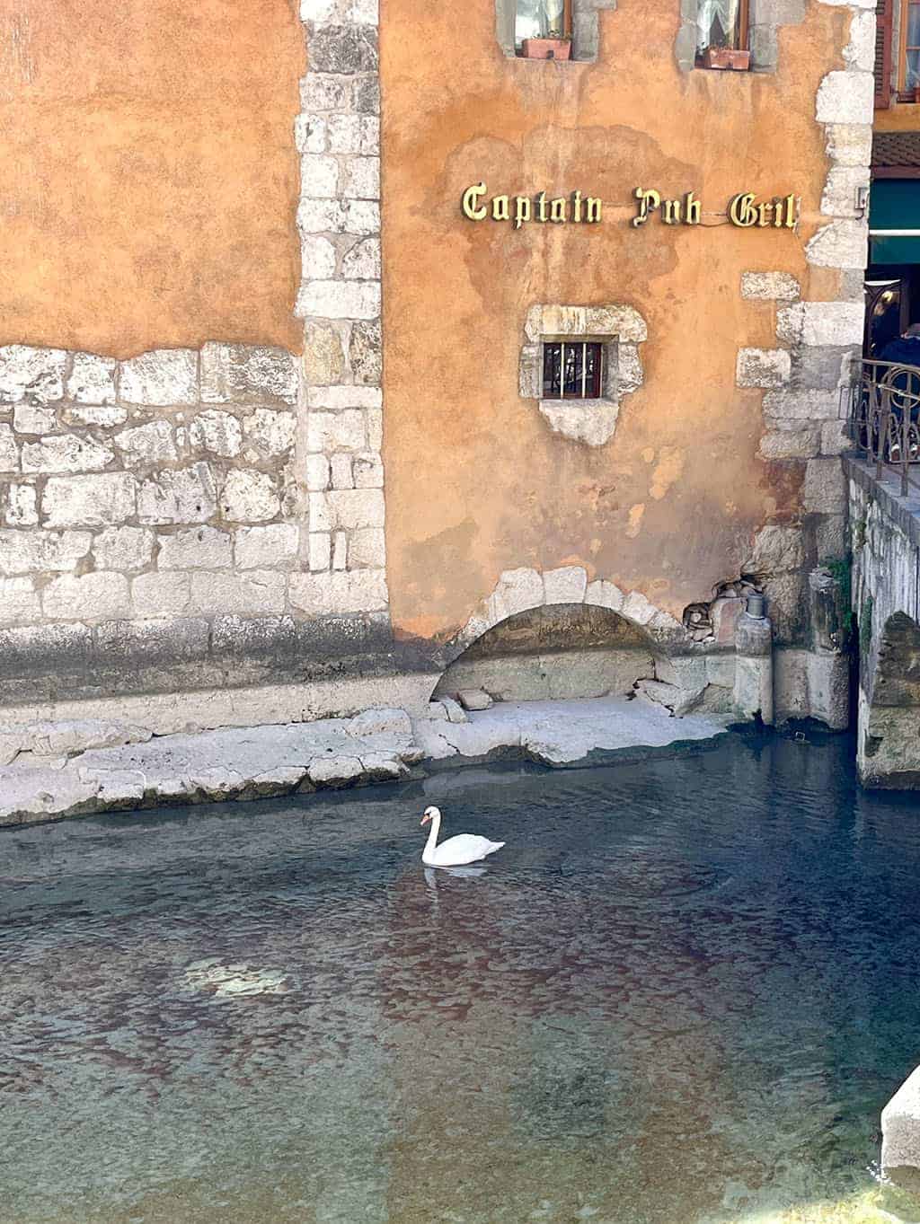 Day trip to Annecy France - Cobblestone streets, colorful architecture, and a stunning crystal blue lake.