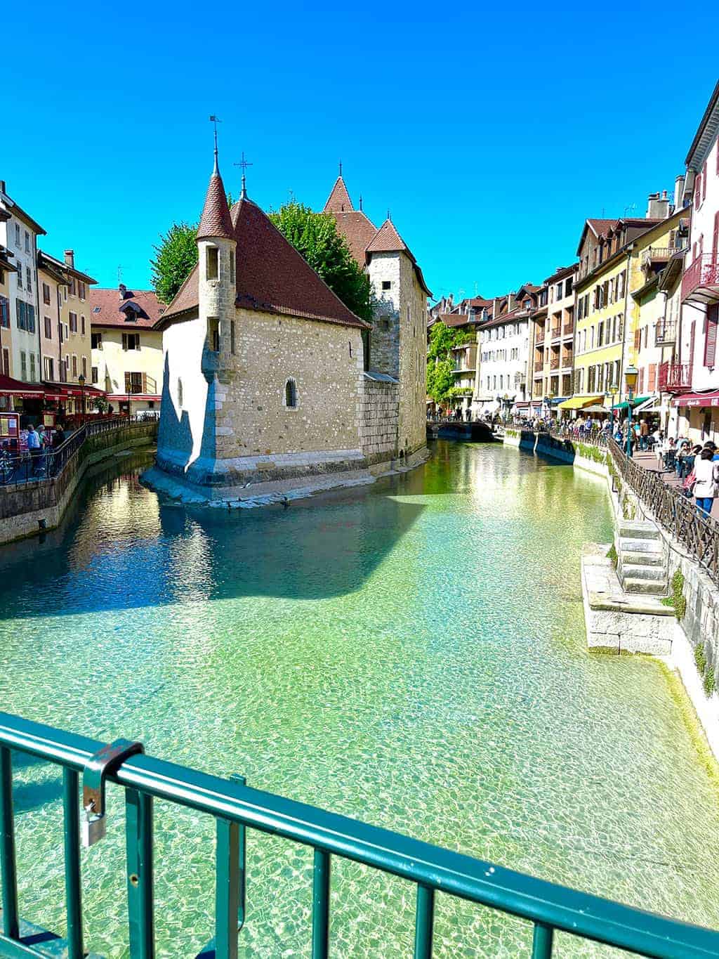 Day trip to Annecy France - Cobblestone streets, colorful architecture, and a stunning crystal blue lake.