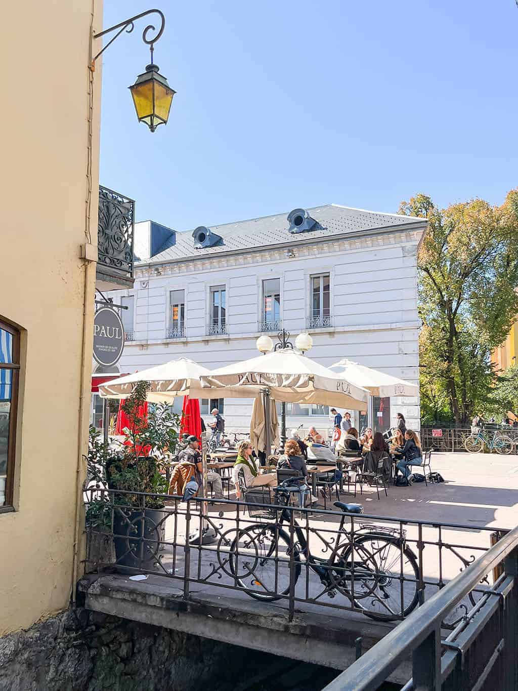 Day trip to Annecy France - Cobblestone streets, colorful architecture, and a stunning crystal blue lake.