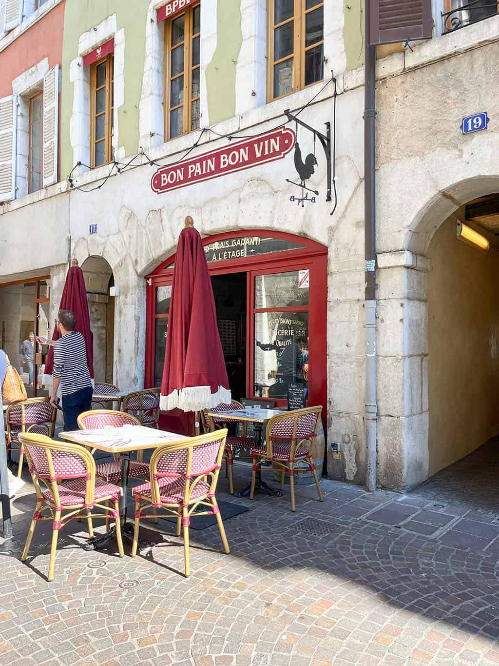 Day trip to Annecy France - Cobblestone streets, colorful architecture, and a stunning crystal blue lake.