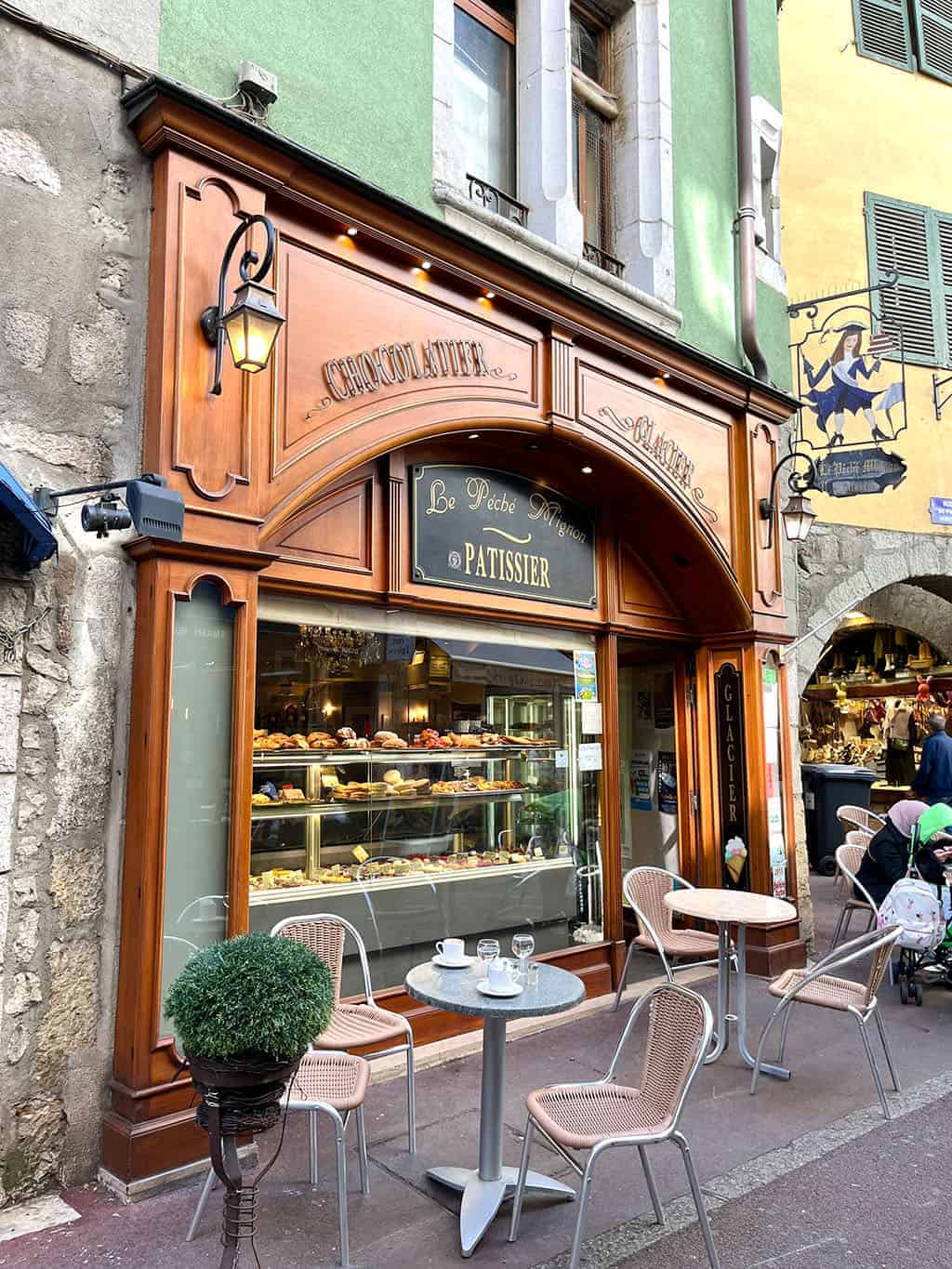 Day trip to Annecy France - Cobblestone streets, colorful architecture, and a stunning crystal blue lake.