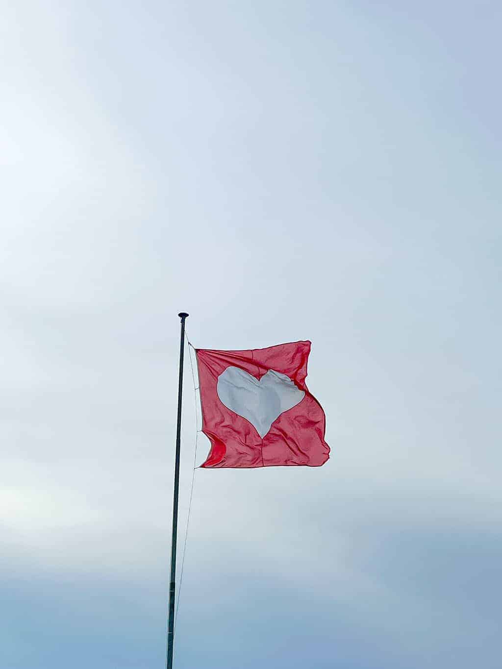 Geneva heart flag in front of The Jet d'Eau