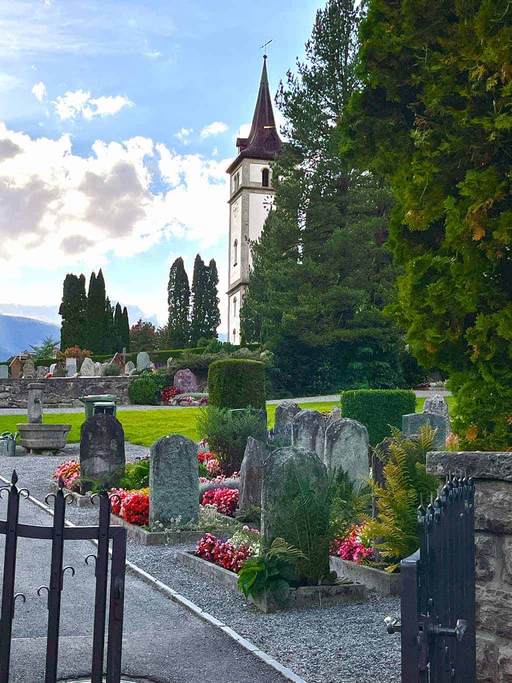 Beautiful graveyard in Grindelwald with colorful flowers everywhere Grindelwald Switzerland is a stunning destination right out of a fairytale! I'm breaking down all the details for our 3 night visit.