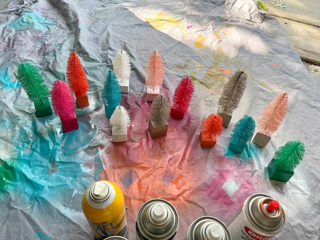 spray painting my diy bottle brush trees in various colors